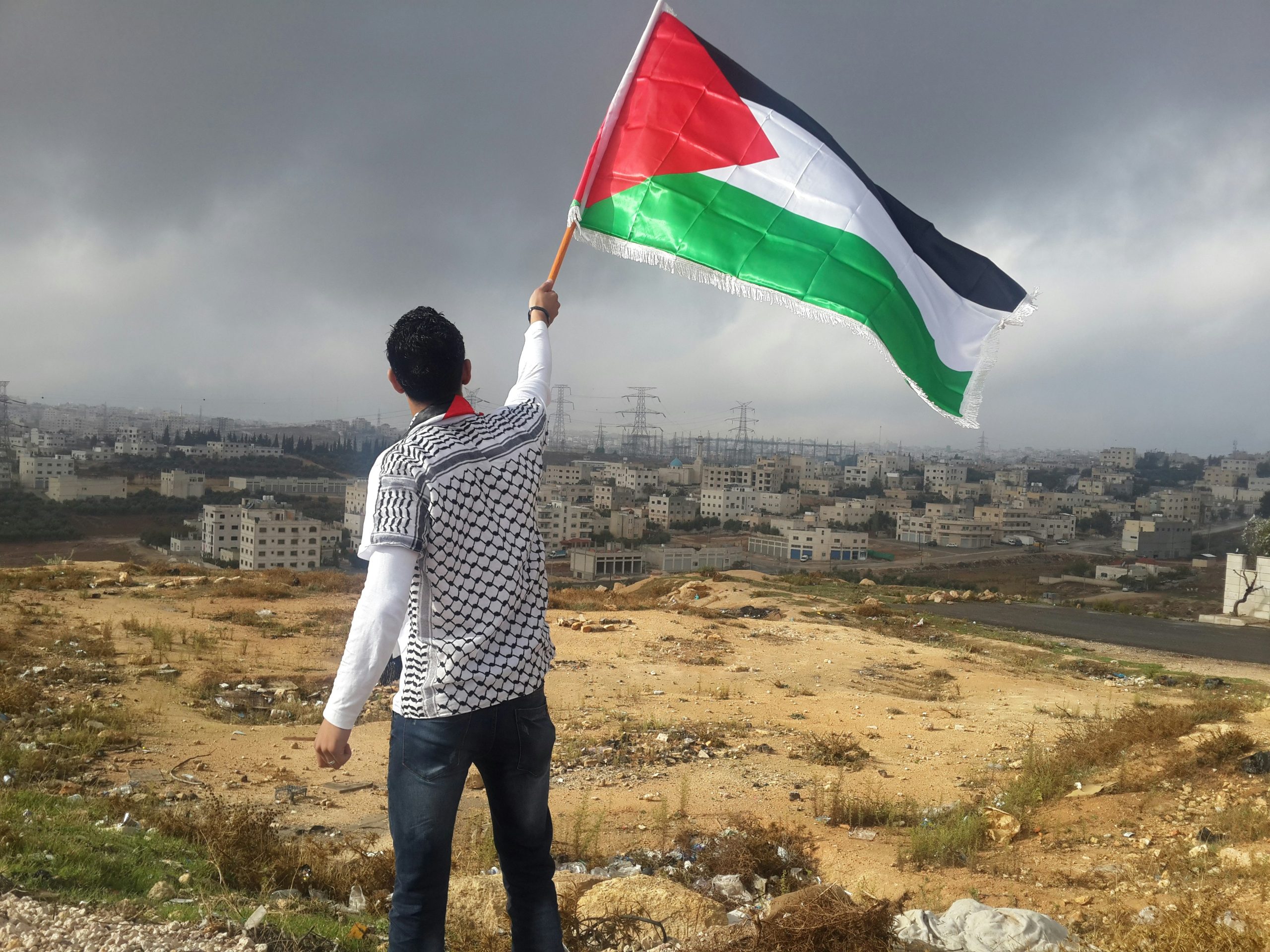 Man holding Palestinian flag